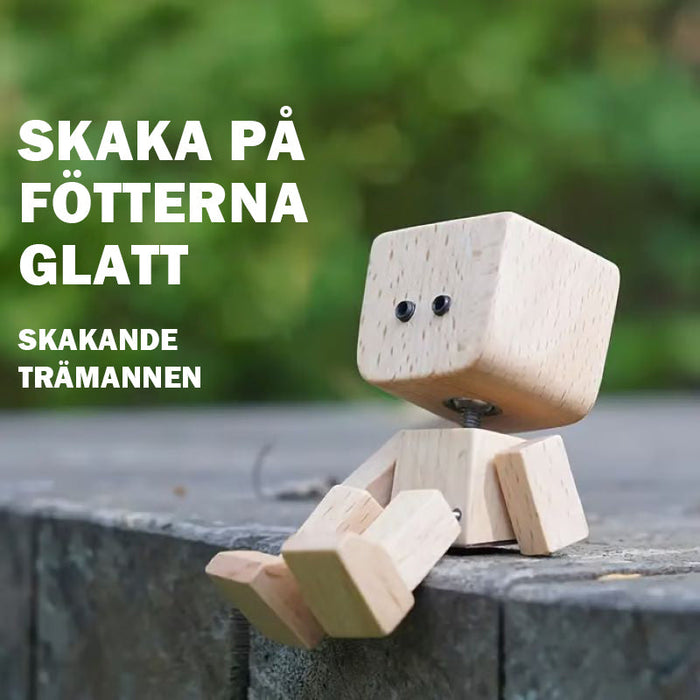 Charmig liten gungfigur i trä med 12 magnetiska uttryck